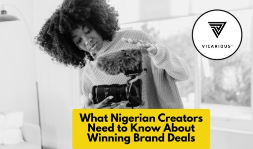 Nigerian content creator setting up a camera for video production, representing brand deals and professionalism.