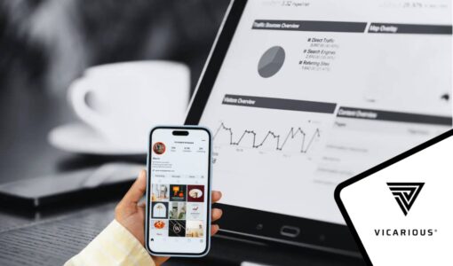 A Nigerian content creator analyzing Instagram insights on a smartphone alongside website analytics displayed on a tablet.
