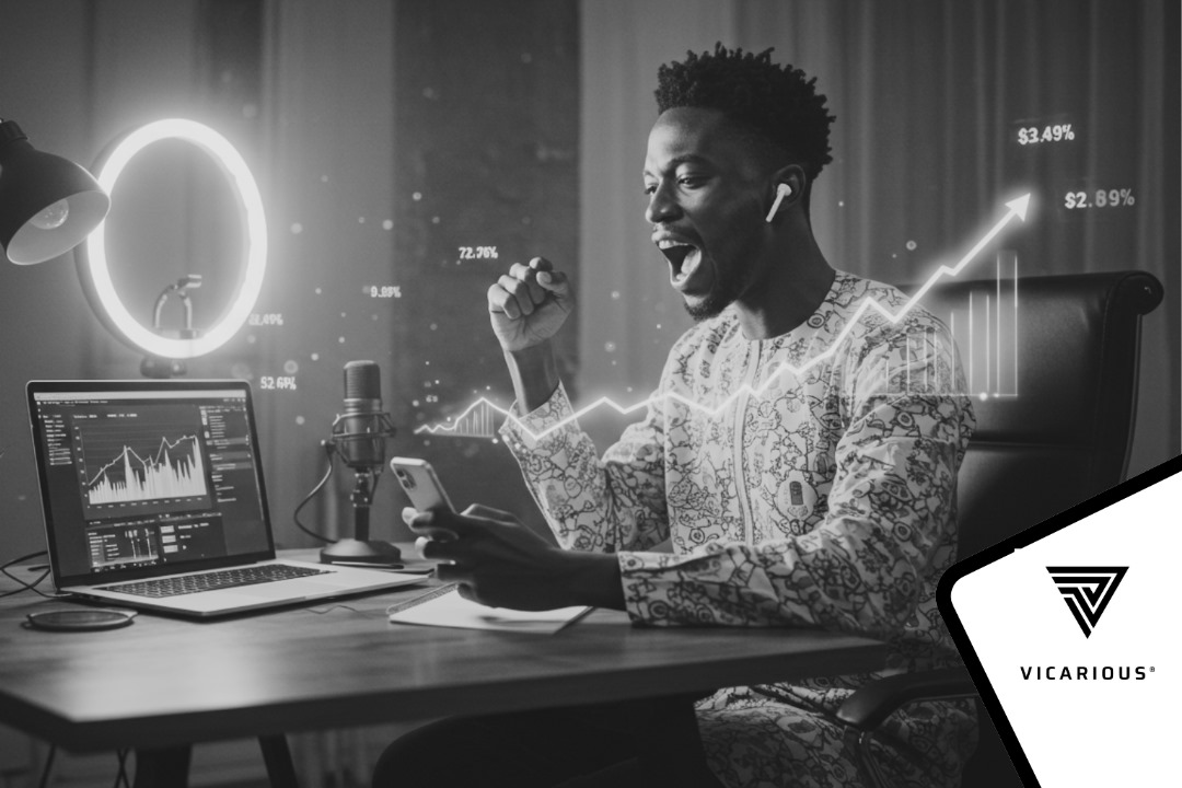 A Digital creator using laptop and smartphone with social media analytics and rising revenue charts on screen, symbolizing audience growth and monetization.”